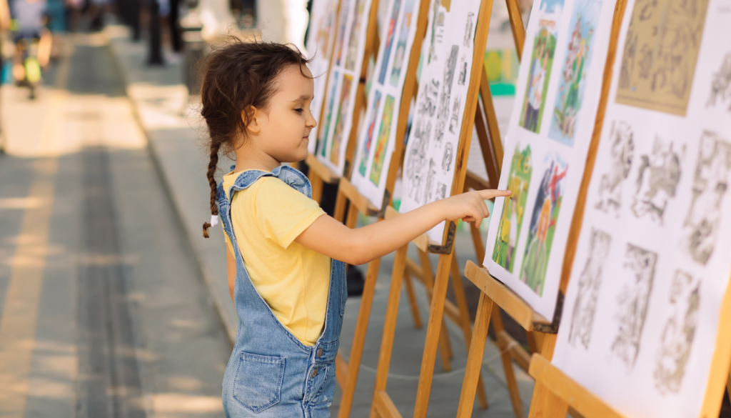 little girl at art in the park on st simons island