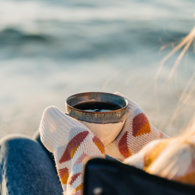 girl having coffee at the beach on st simons island
