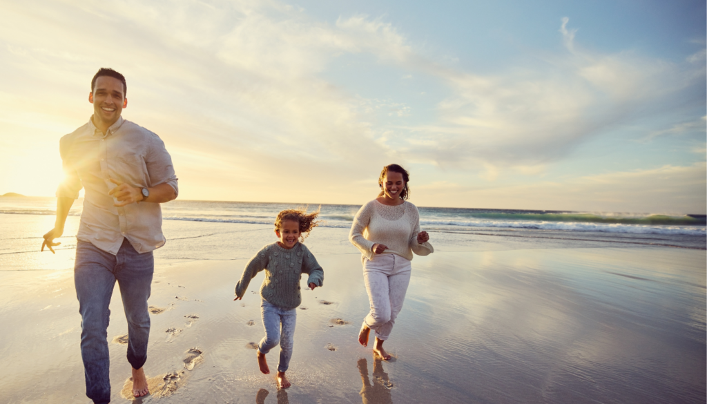 family running on st simons beach in winter