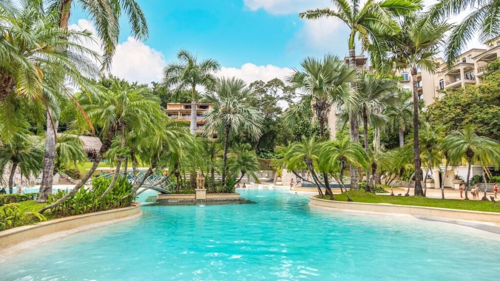 Diria Resort pool surrounded by palm trees