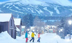 Skiers cross Main Street in Breckenridge after a mountain snow storm dropped a foot of new powder.