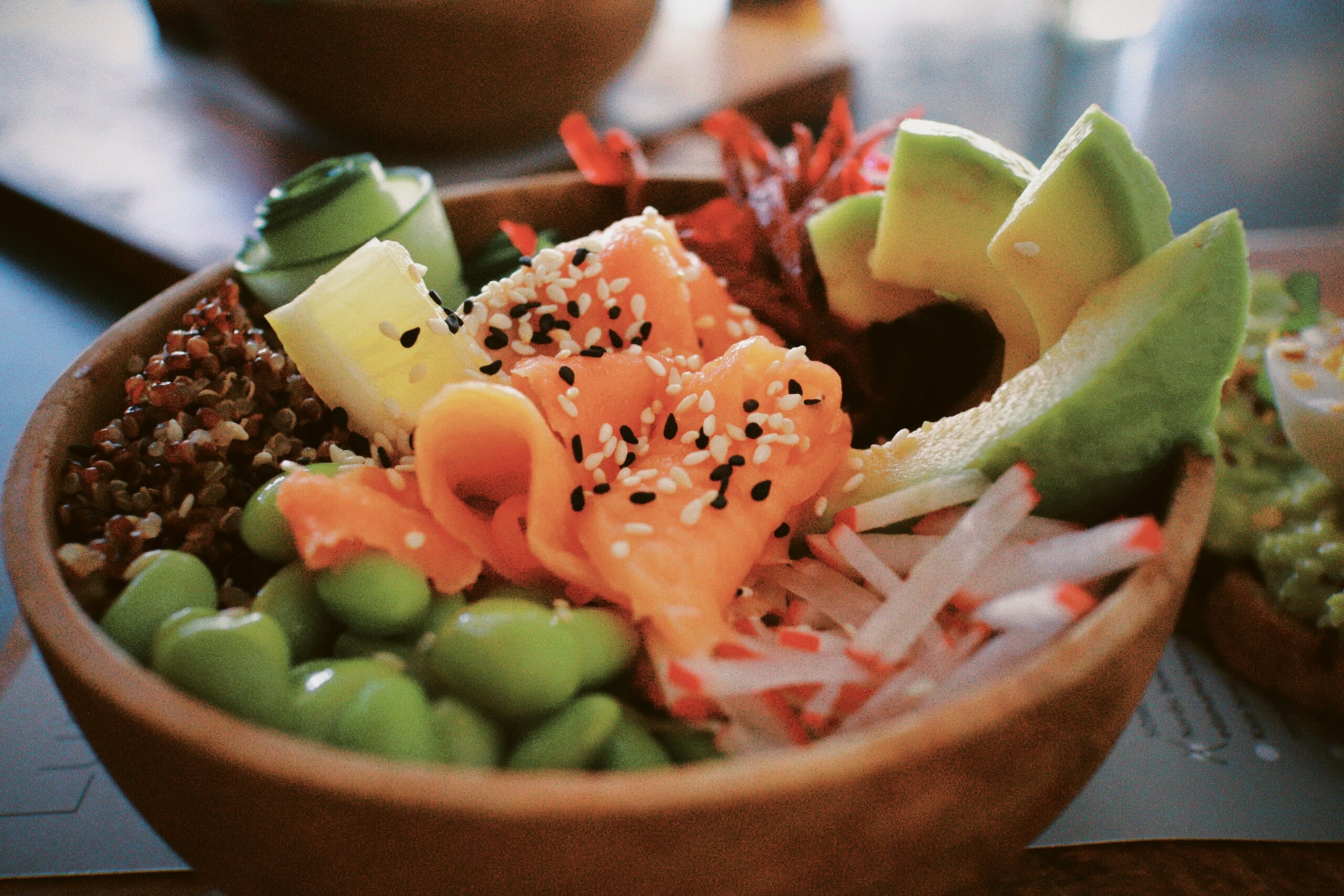 Poke Bowl with assorted fresh seafood and vegetables.