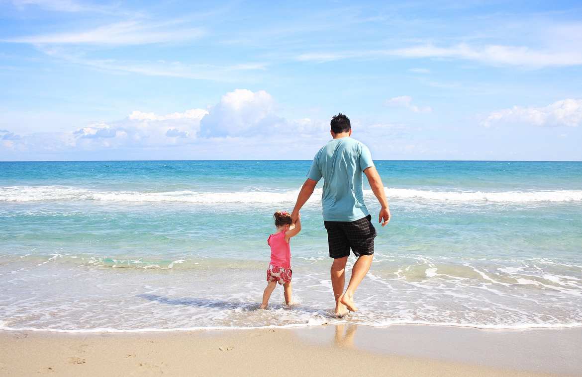 image of dad with kid on the beach