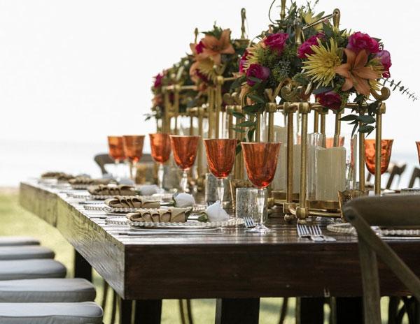 orange tinted wine glasses on dining table