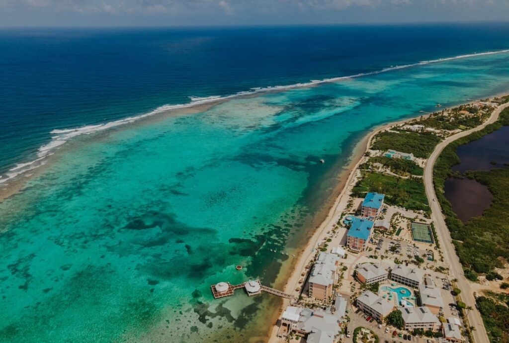 Aerial view of Grand Cayan's coastline with blue waters