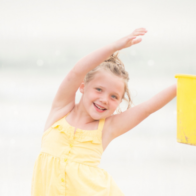 little girl with Easter basket at the beach