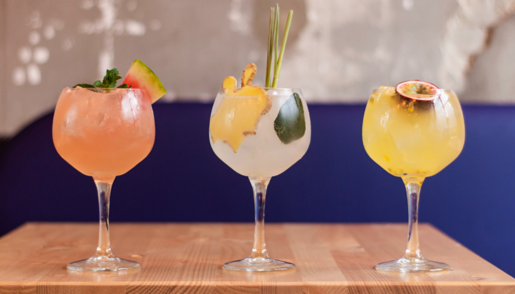 three summer cocktails on a table