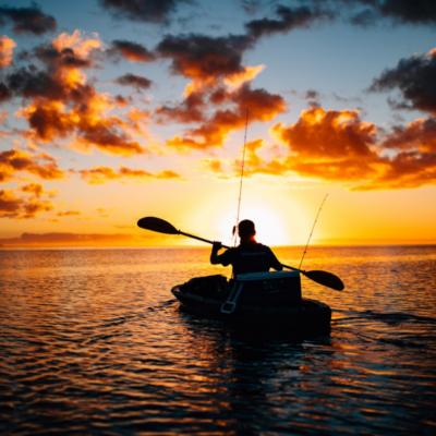 man paddling kayak at sunset on the Gulf of Mexico