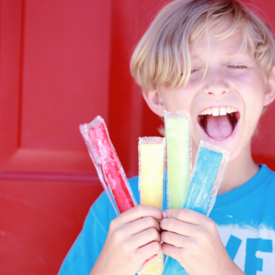 boy with popsicles at Destin ice cream shop