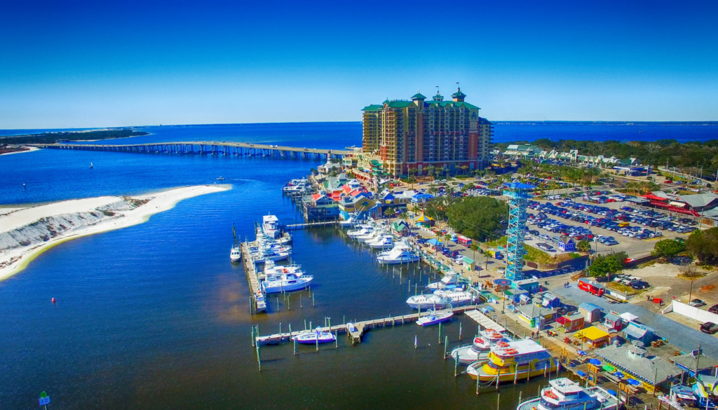 aerial view of the destin harbor, bridge, and harborwalk village