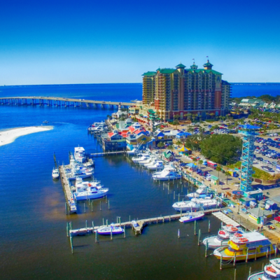 aerial view of the destin harbor, bridge, and harborwalk village