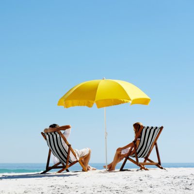 couple in beach chairs on beach