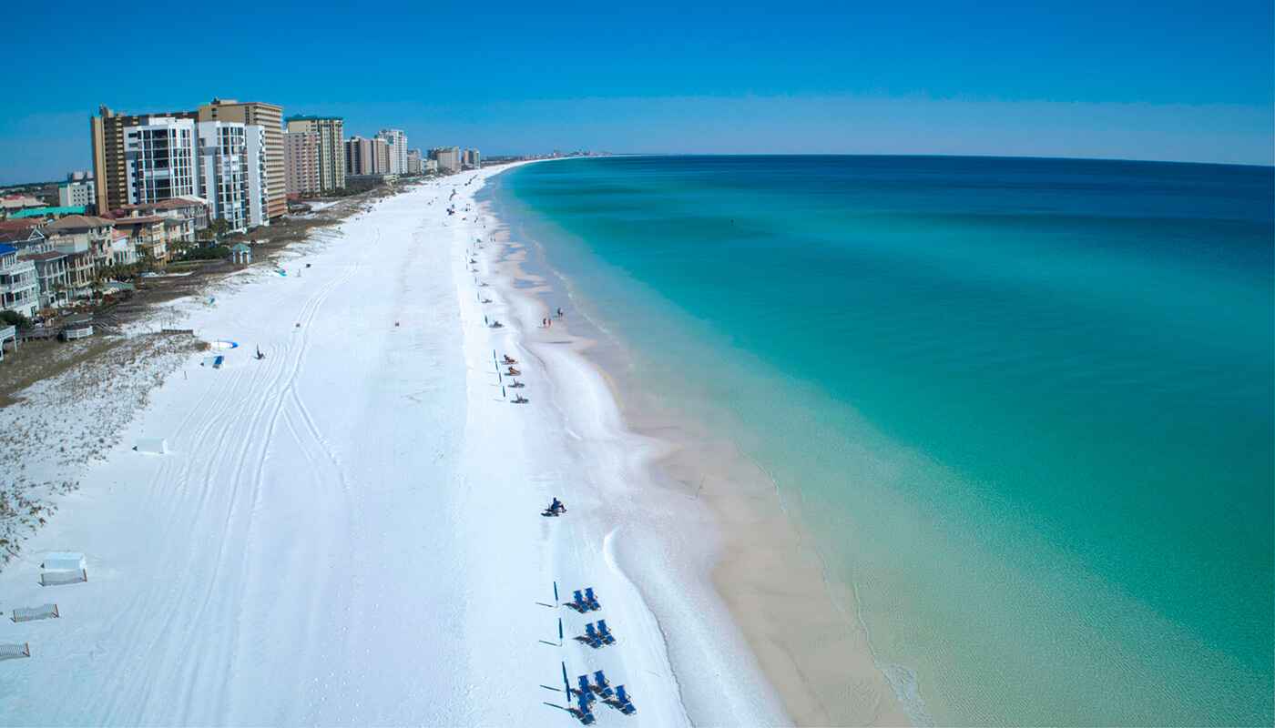 aerial view of the beach, condos, and vacation homes in destin, florida