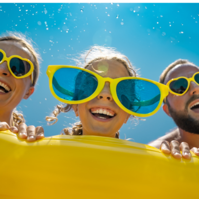 family on a raft in a northwest florida pool during spring break