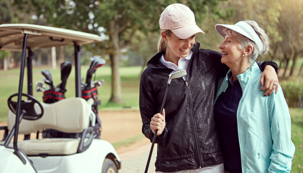 mother and daughter golfing in northwest florida during winter