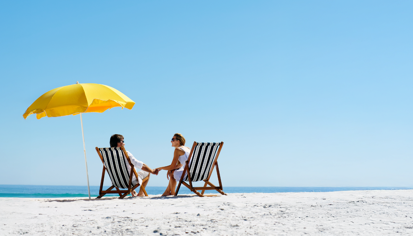 couple on the beach in destin using scenic stays concierge services