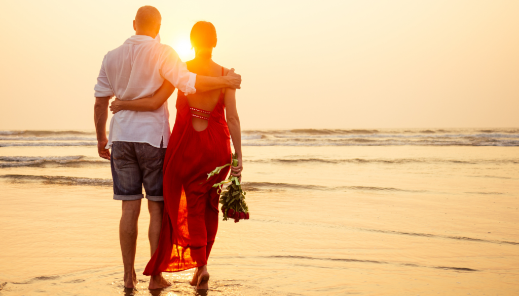 couple walking on the beach on valentine's weekend in northwest florida