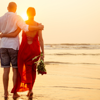 couple walking on the beach on valentine's weekend in northwest florida