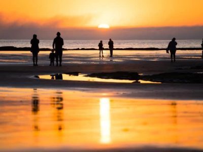 family walking on the beach