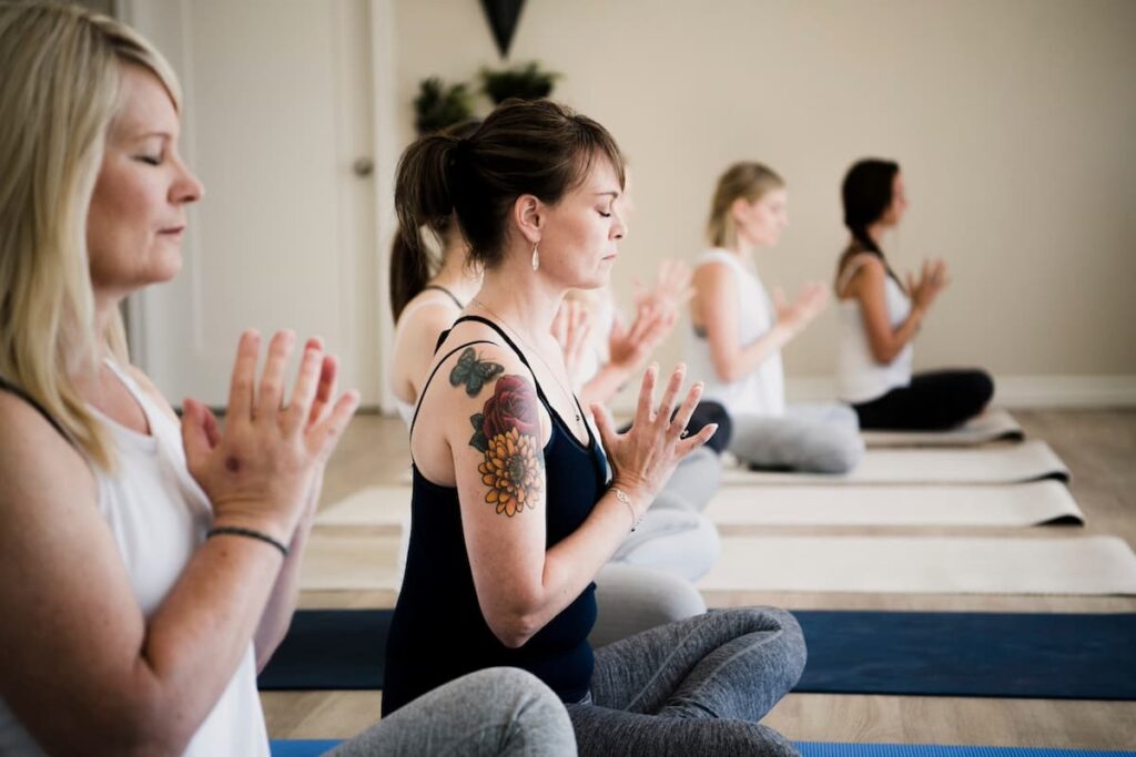 Women enjoying a private yoga session in their holiday accommodation