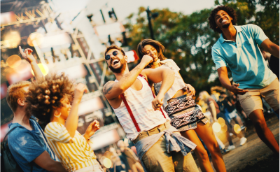 Friends Dancing at Music Festival