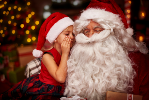 Kid whispering Into Sant's Ear