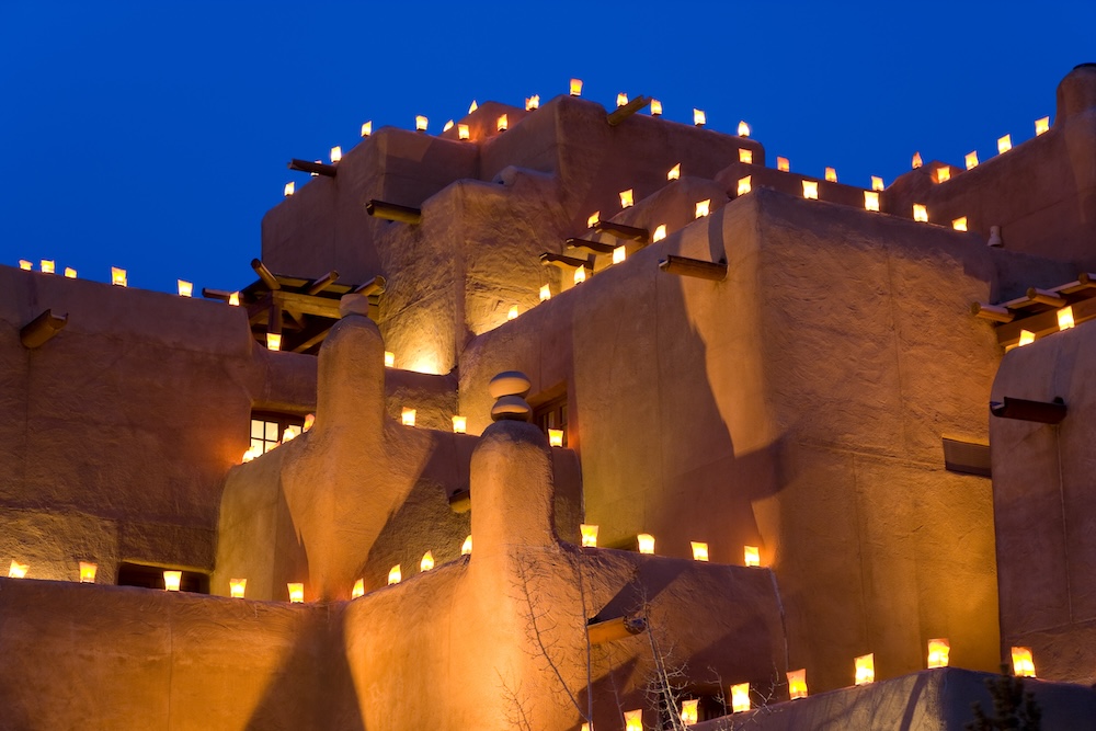 Adobe home near downtown Santa Fe  with lights on at night