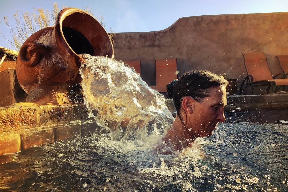 Woman soaking in hot spring