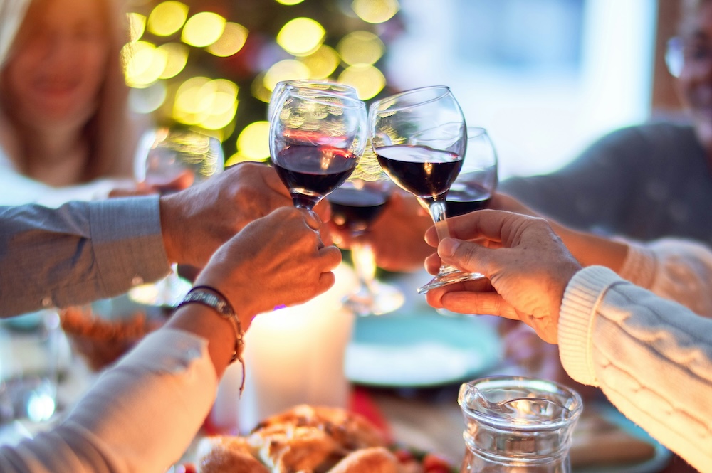 Family toasting over holiday dinner