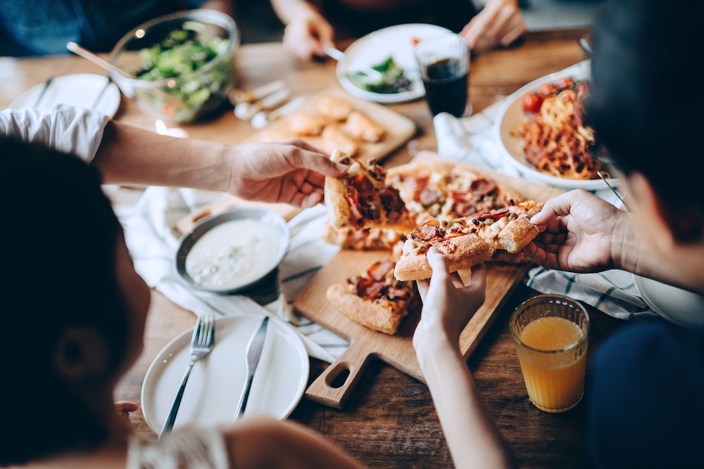 Friends sharing a pizza