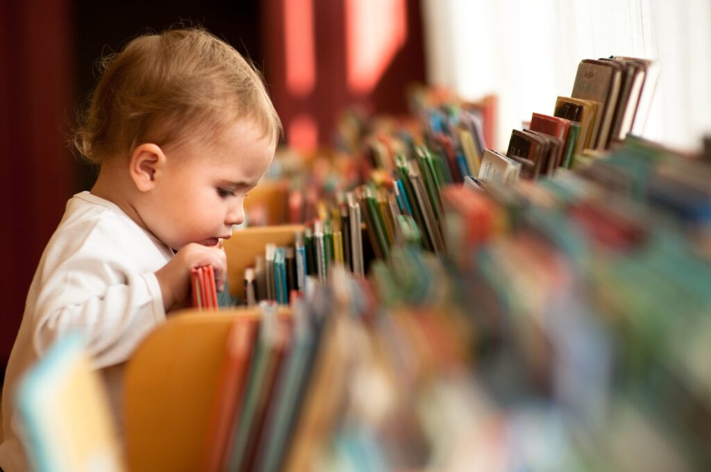 baby looking at books
