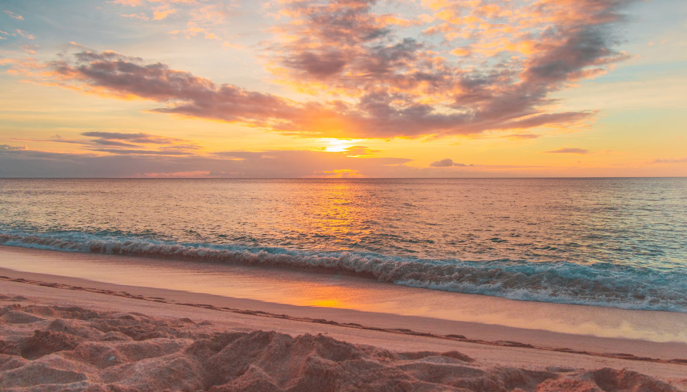 sunset over the beach in gulf shores