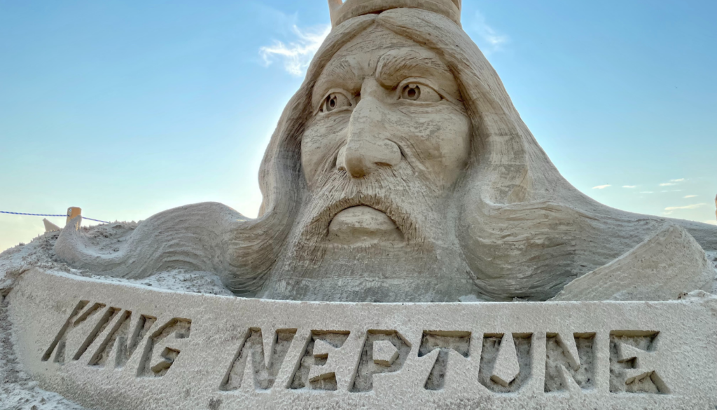 large sand sculpture of king neptune