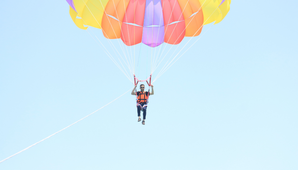 man parasailing along alabama's gulf coast