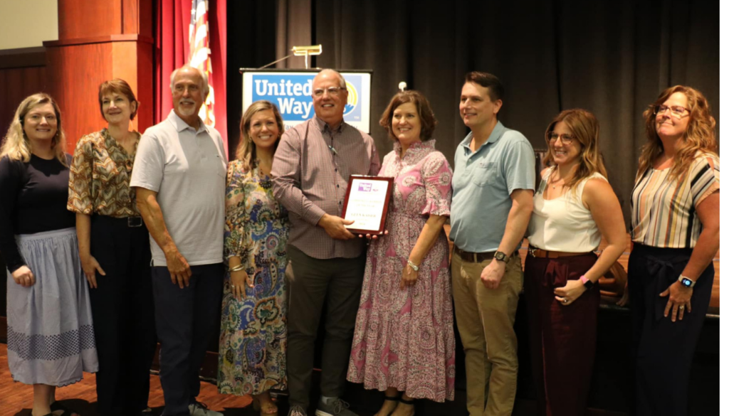 Glen Kaiser accepting United Way award at community function