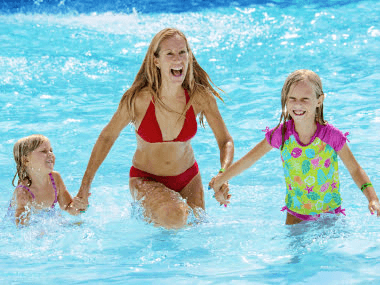 A perfect family-friendly holiday in Destin - Mom and daughters at Big Kahuna’s Water Park.