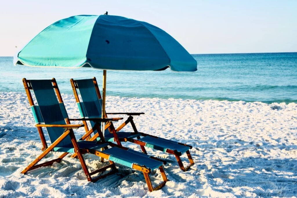 Two sunbeds and umbrella on Destin beach