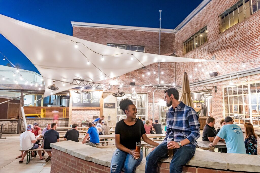 People enjoying drinks outside in downtown asheville