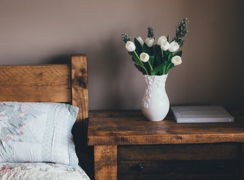 white flowers on side bench