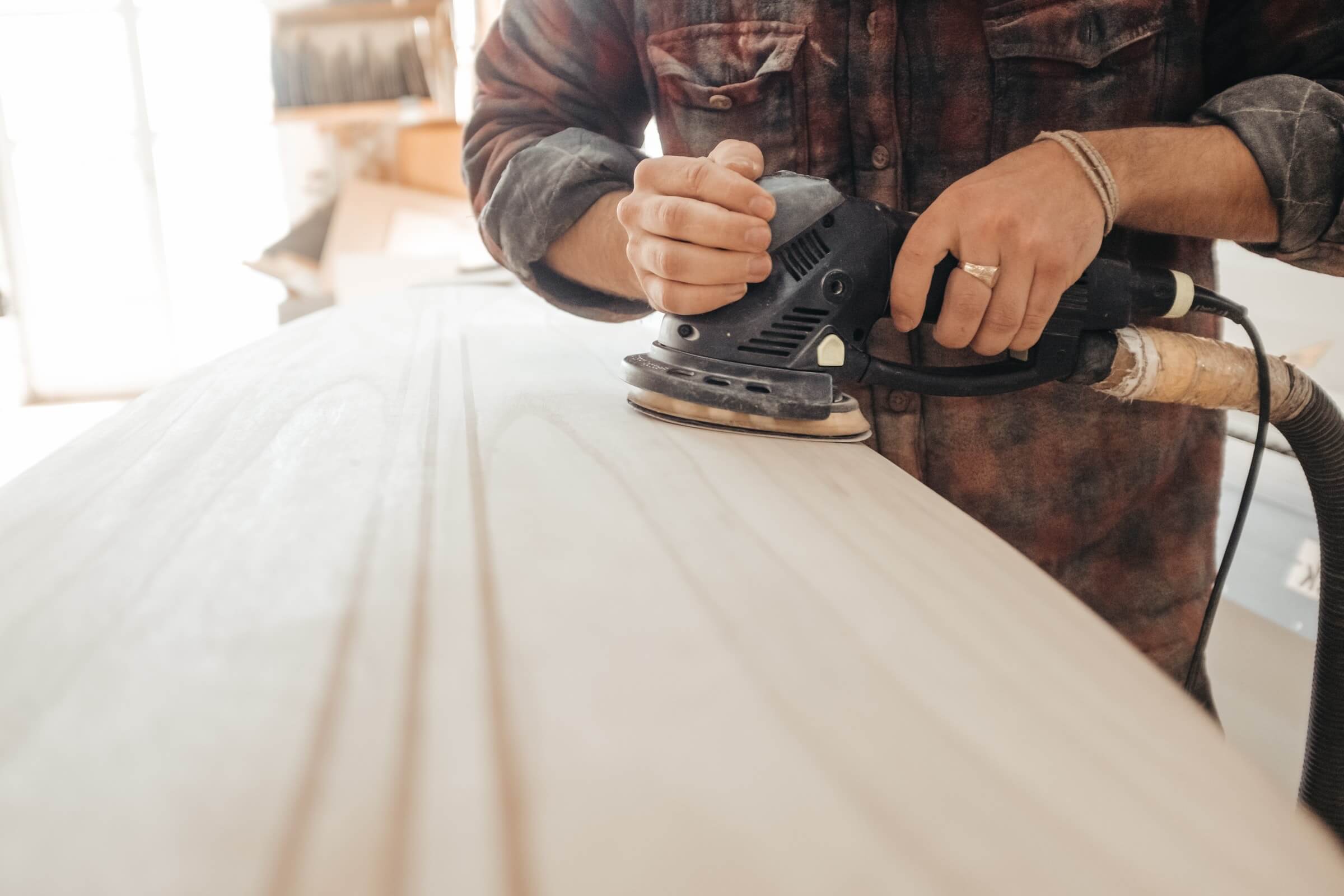 image of man working on wood