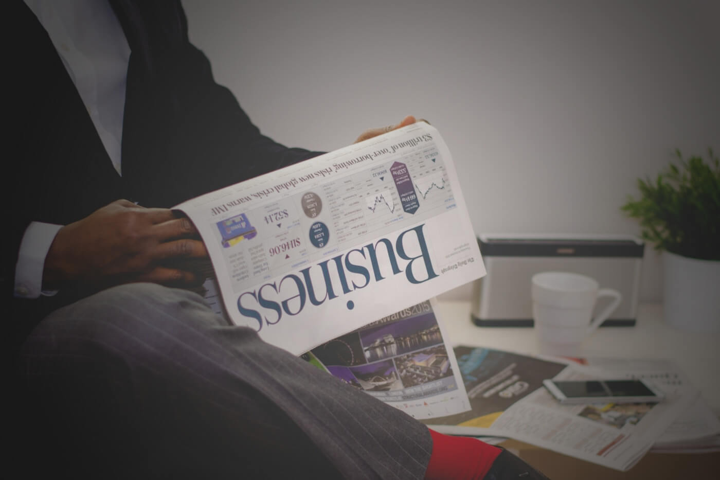 man reading business news paper