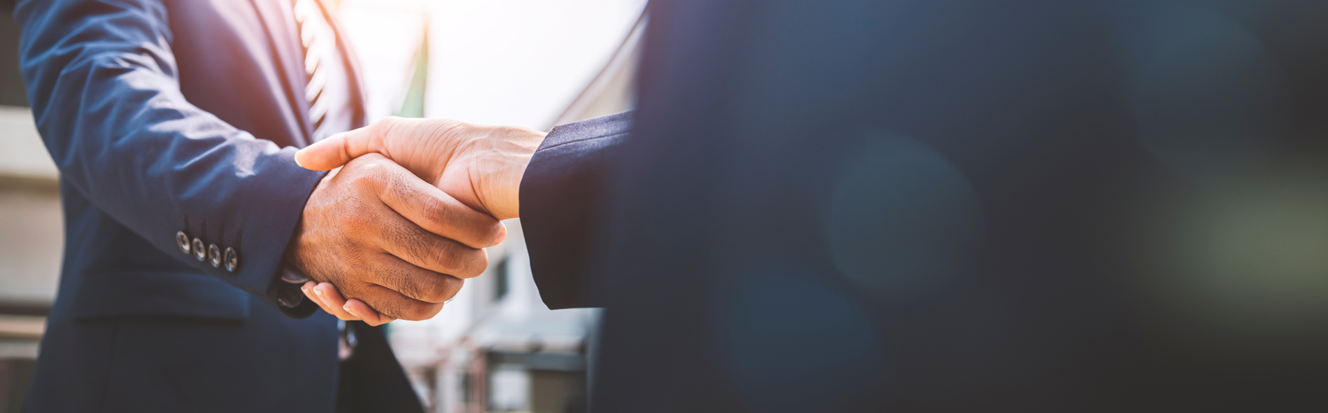 image of two people handshaking