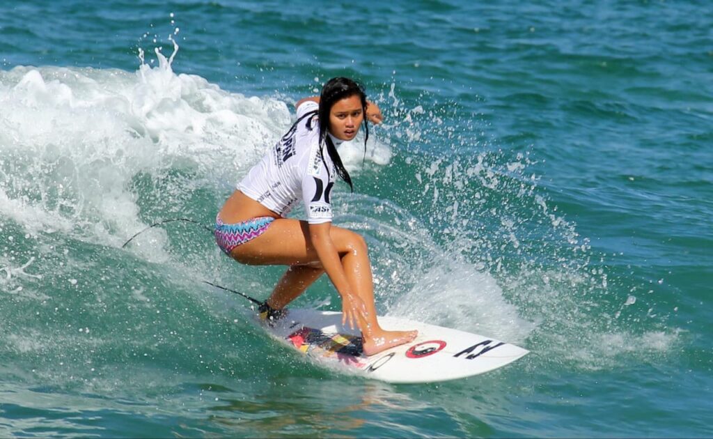 Woman surfing in Manly International Surf Competition
