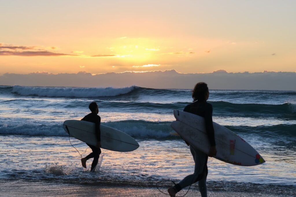 Two People Surfing in Manly Beach