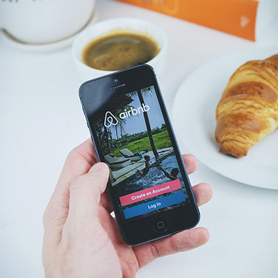 airbnb, app, apple, book, coffee, croissant, hand, holding, ios, iphone, mobile, phone, table, white, airbnb, airbnb, airbnb, airbnb