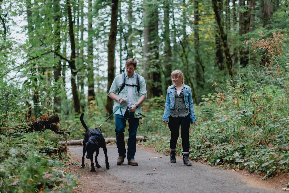 Couple hiking with their dog in the Pacific Northwest