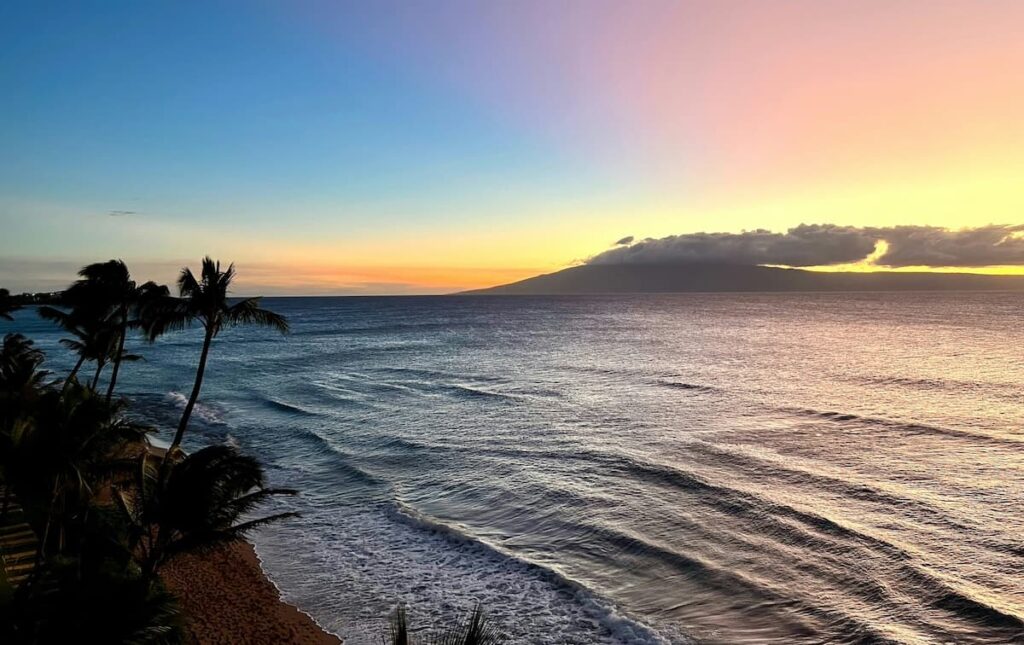 Pink and blue skies over the ocean at sunset on Maui