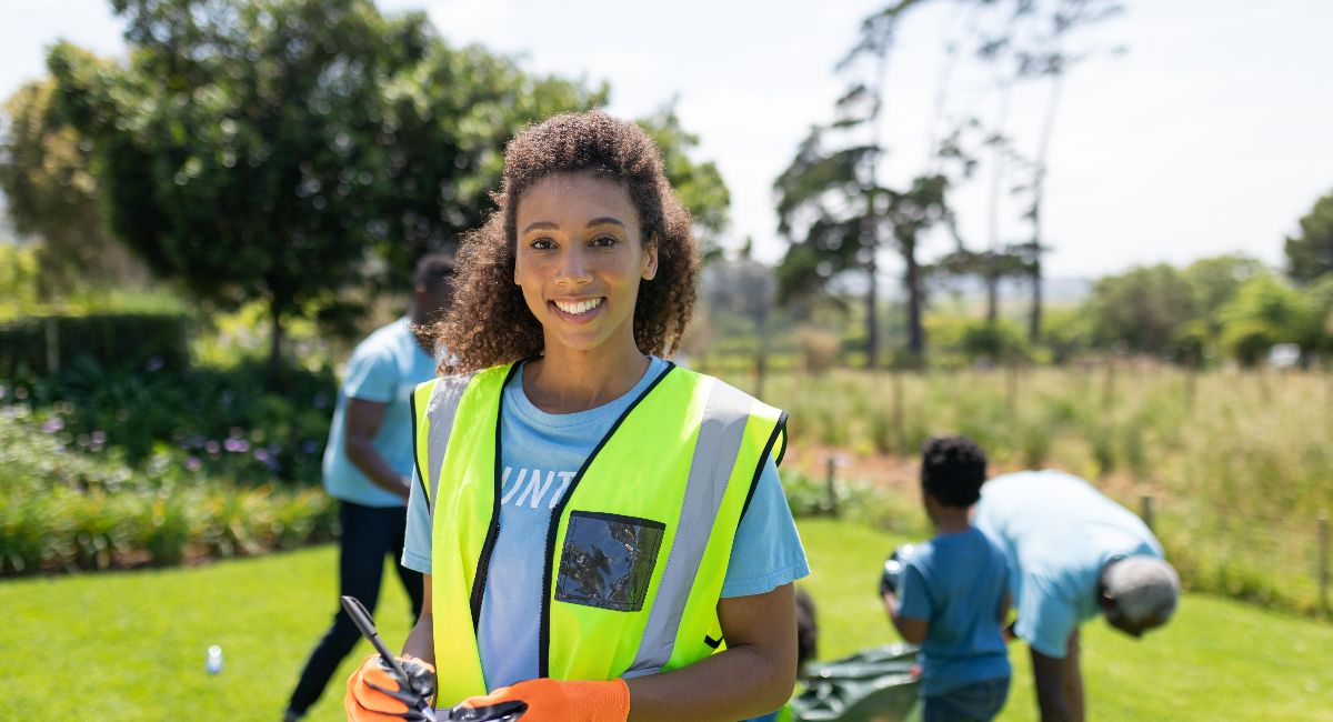 Front view of a young African American woman volunteering on maui