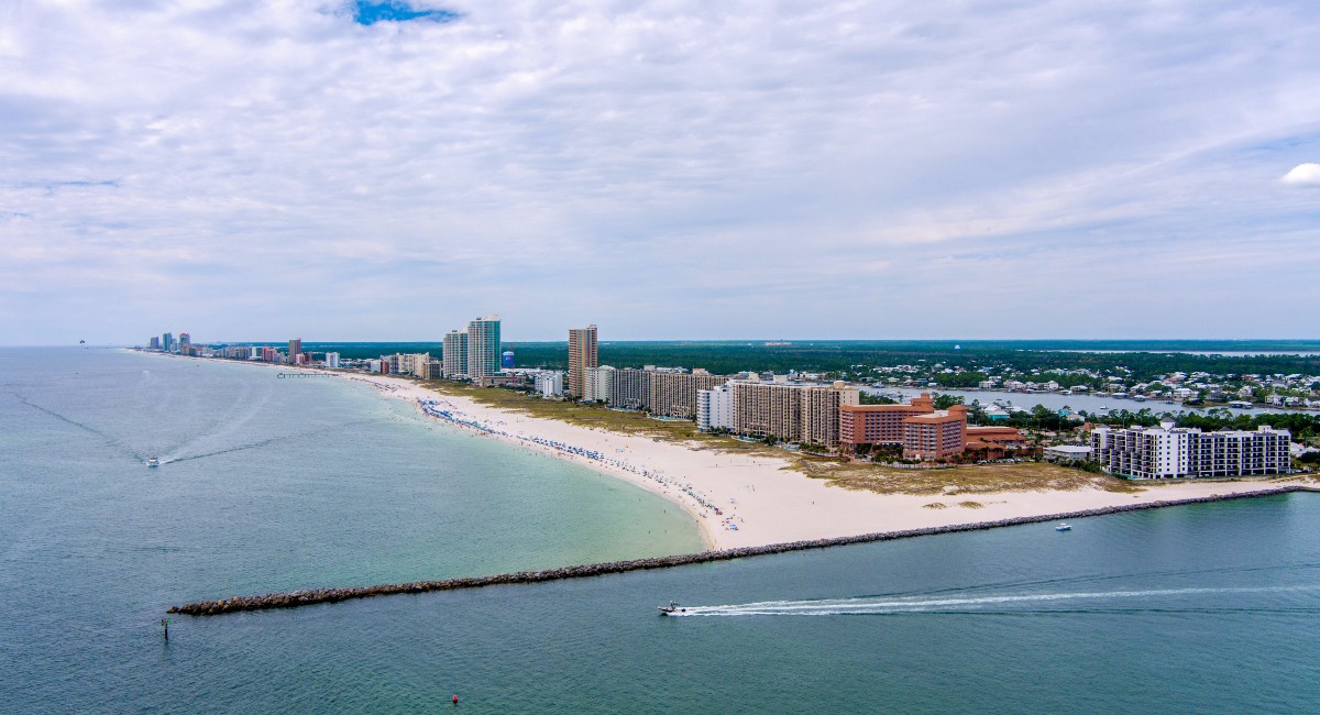 Aerial view of Orange Beach with the resorts, beaches and beach in view on a clear day