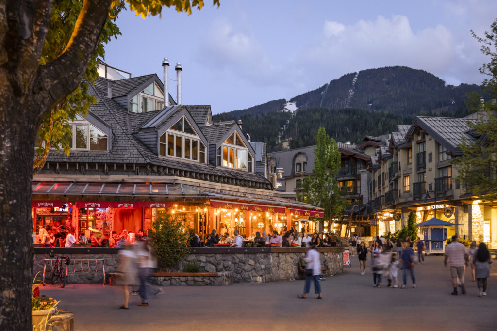 Whistler Village at sunset with restaurants and mountain views – book Whistler reservations with Whistler Superior Properties